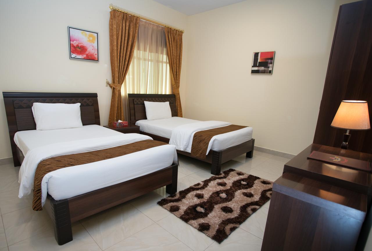 Tiger Home Hotel Apartments Muskat Eksteriør bilde
